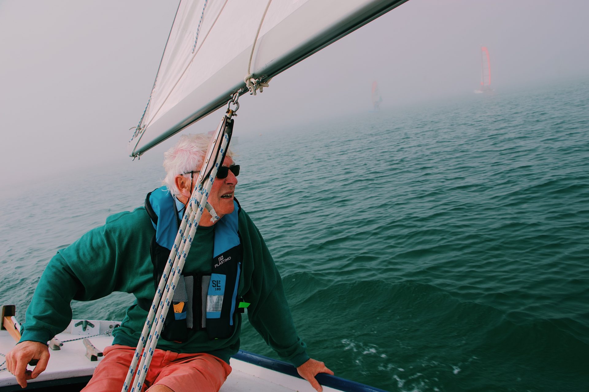 Older man sailing and enjoying his longer life because of the simple lifestyle changes he made years ago.