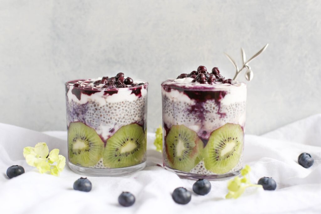 Two yogurt parfaits with Salvia Hispanica, blueberries & kiwi.