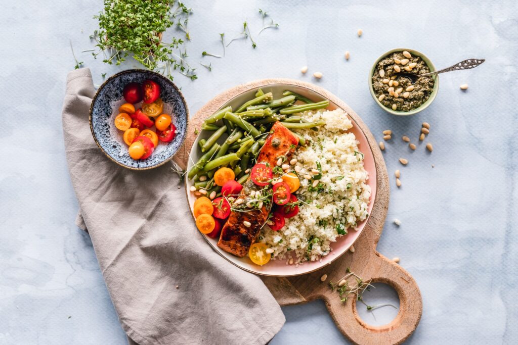 If you're eating for health, this plate of green beans, fresh tomatoes, quinoa and salmon fits the bill.