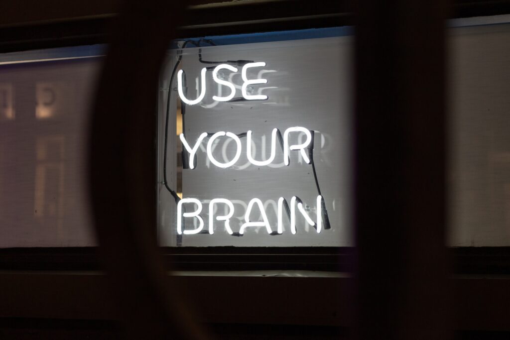 Neon sign stating, "Use your brain."