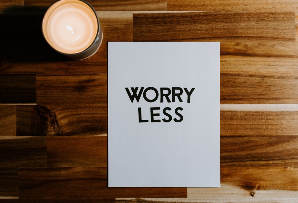 Sign stating "Worry Less" which is one way you can strengthen a weak immune system.