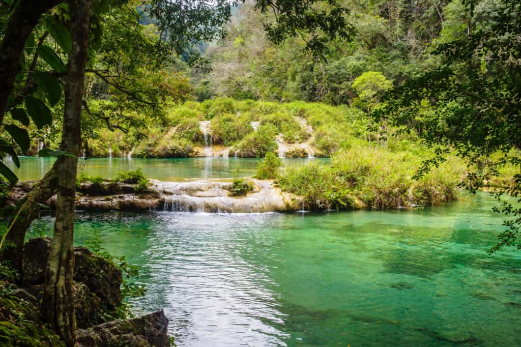 Waterfall in a lush tropical setting.