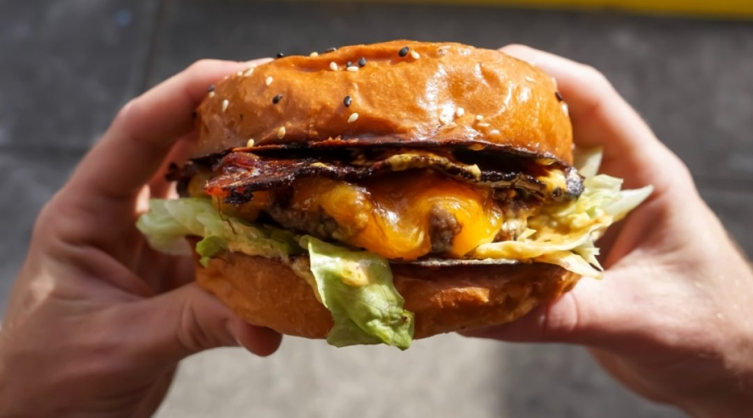 Regularly eating foods like this delicious cheese burger is an unhealthy disease-inducing habit.