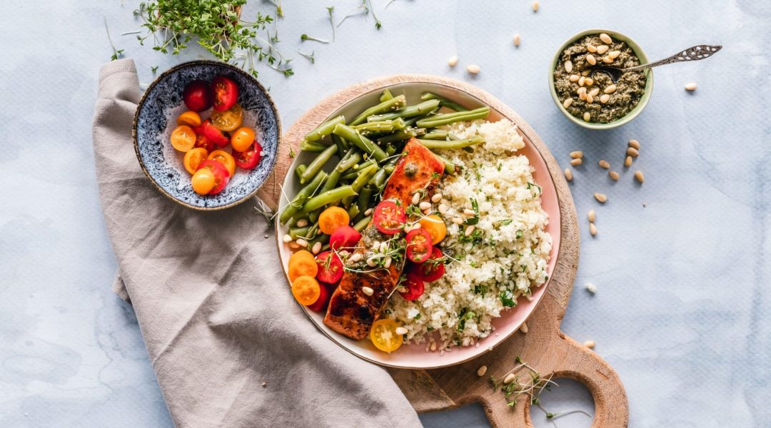 If you're eating for health, this plate of green beans, fresh tomatoes, quinoa and salmon fits the bill.