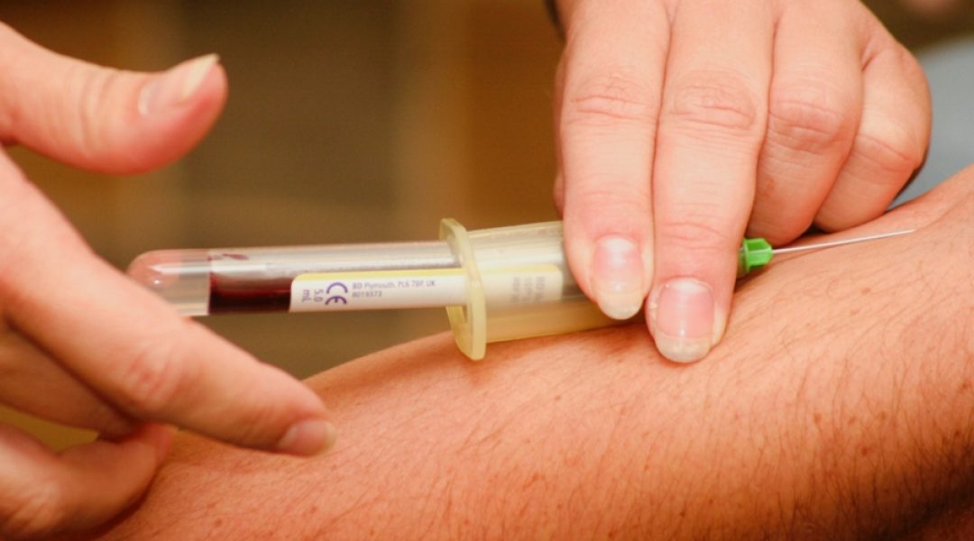 Man having blood drawn to test his homocysteine levels.