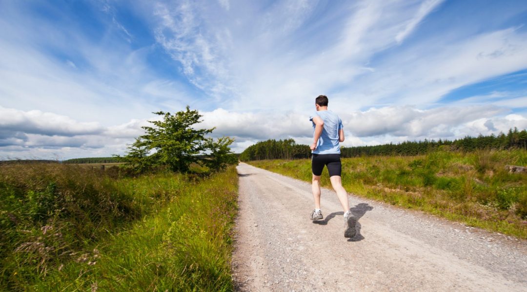 Man jogging on a trail as part of his regime to avoid statins.